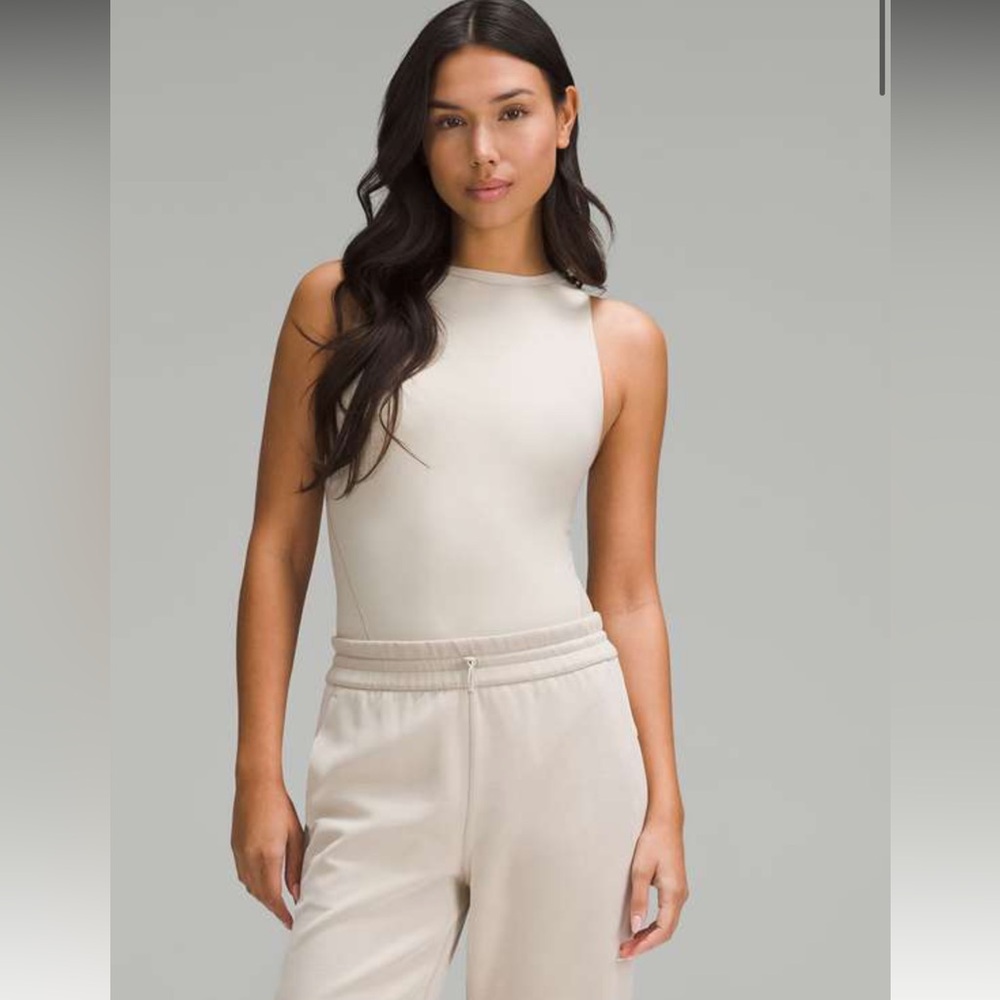 187. NWT Lululemon Wundermost Ultra-Soft Nulu High-Neck Bodysuit
Mojave Tan - Picture 3 of 10